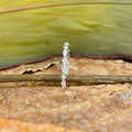 Alternating marquise and round moissanite full eternity band displayed in a jewelry box