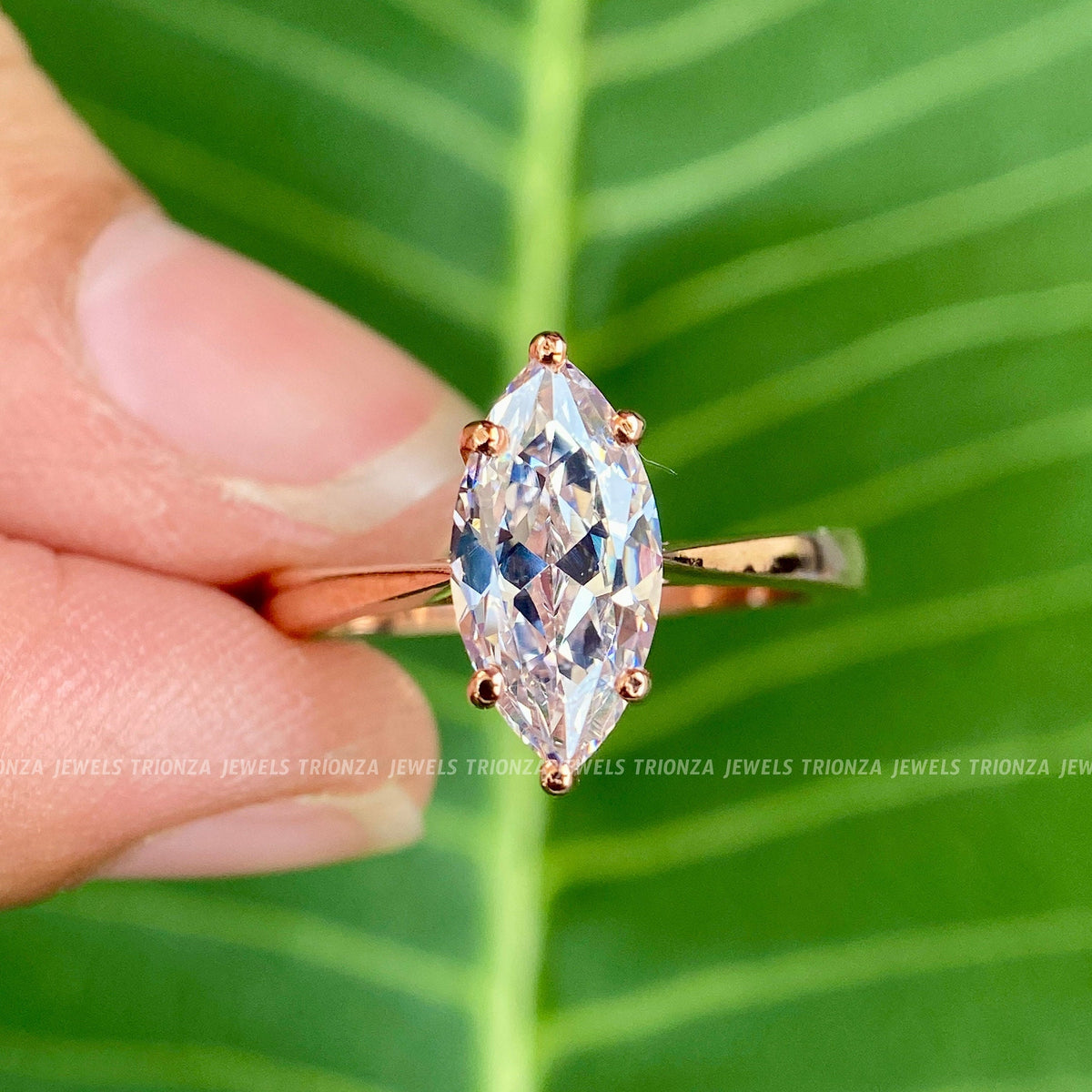 14k yellow gold marquise cut moissanite ring displayed in a jewelry box for anniversary gifting