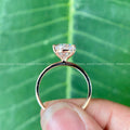 Side view of the halo prong setting highlighting the ring's minimalist vintage details