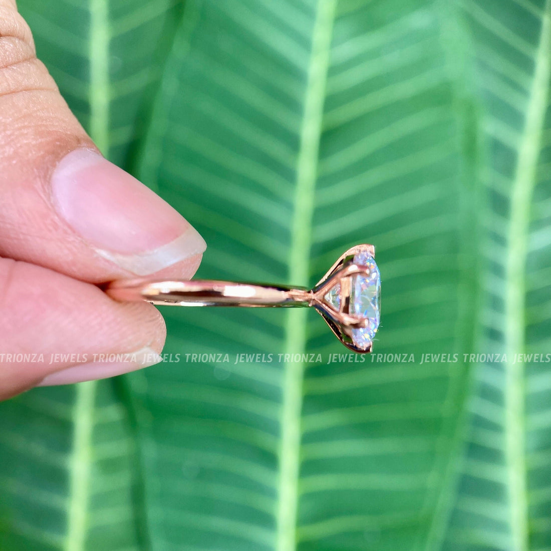 Round cut moissanite solitaire ring featuring a secure 6 prong setting in 14K rose gold