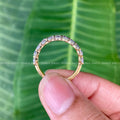 Oval cut moissanite band displayed in a jewelry box with smooth fabric included