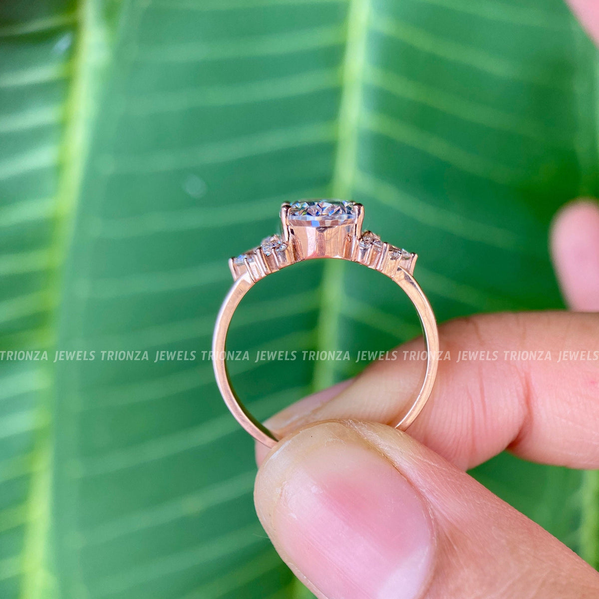 Handmade 14K gold engagement ring designed with colorless moissanite stones throughout