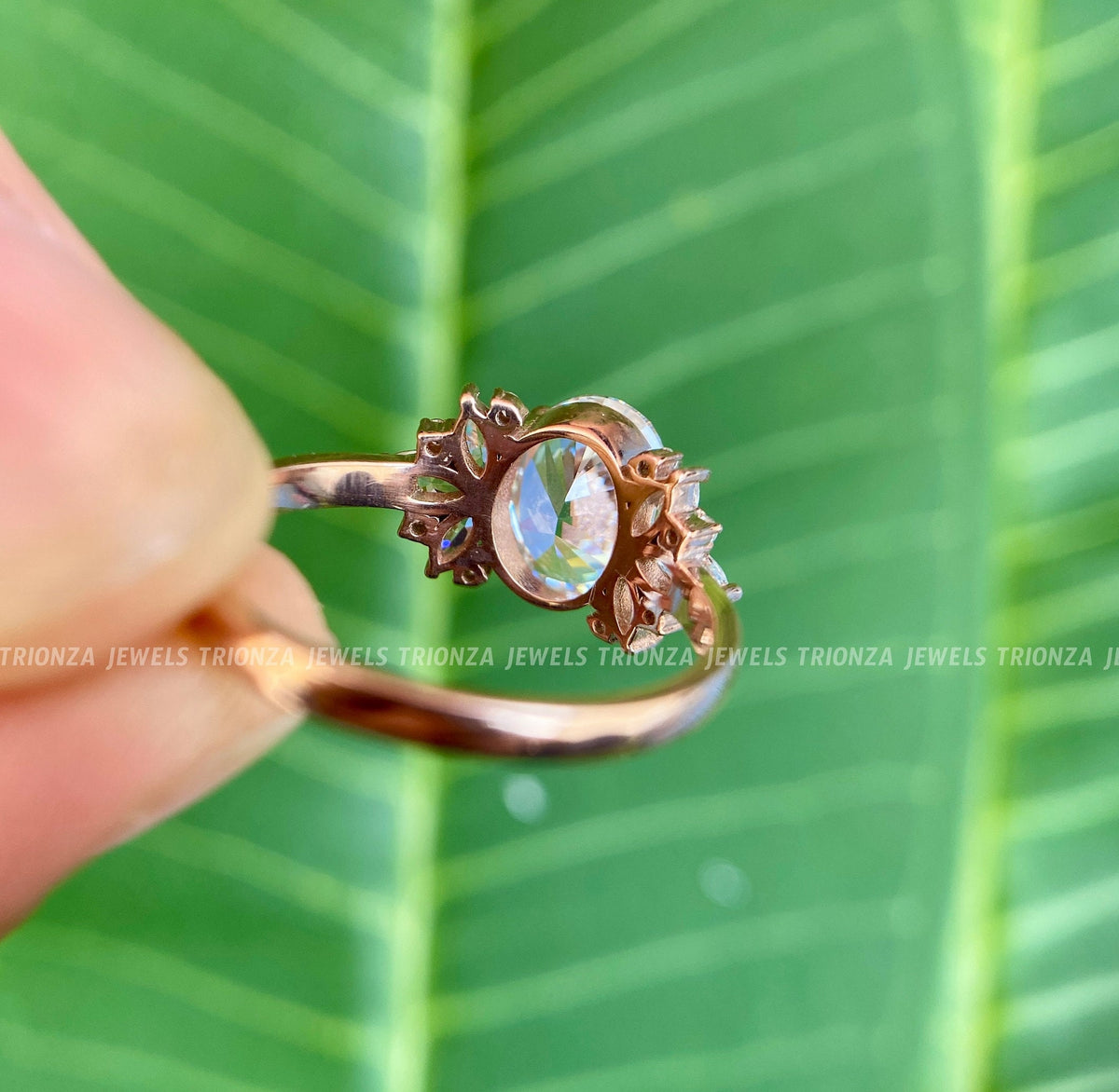 Moissanite engagement ring shown in a jewelry box with the included smooth fabric