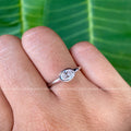 Close-up of the 0.50 ct oval cut moissanite showing its colorless VVS clarity