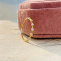 Thin distance stacking ring designed with a minimalist half eternity band style