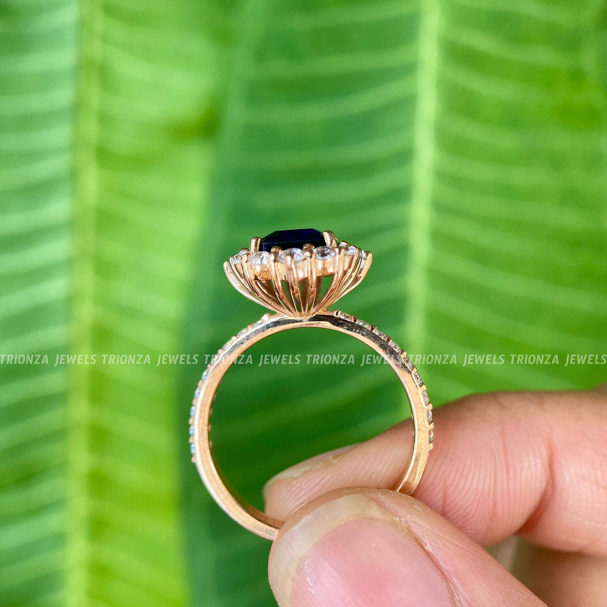 Woman wearing the moissanite halo engagement ring, close-up on her hand