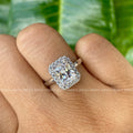 Close-up of the prong and halo setting surrounding the radiant cut moissanite