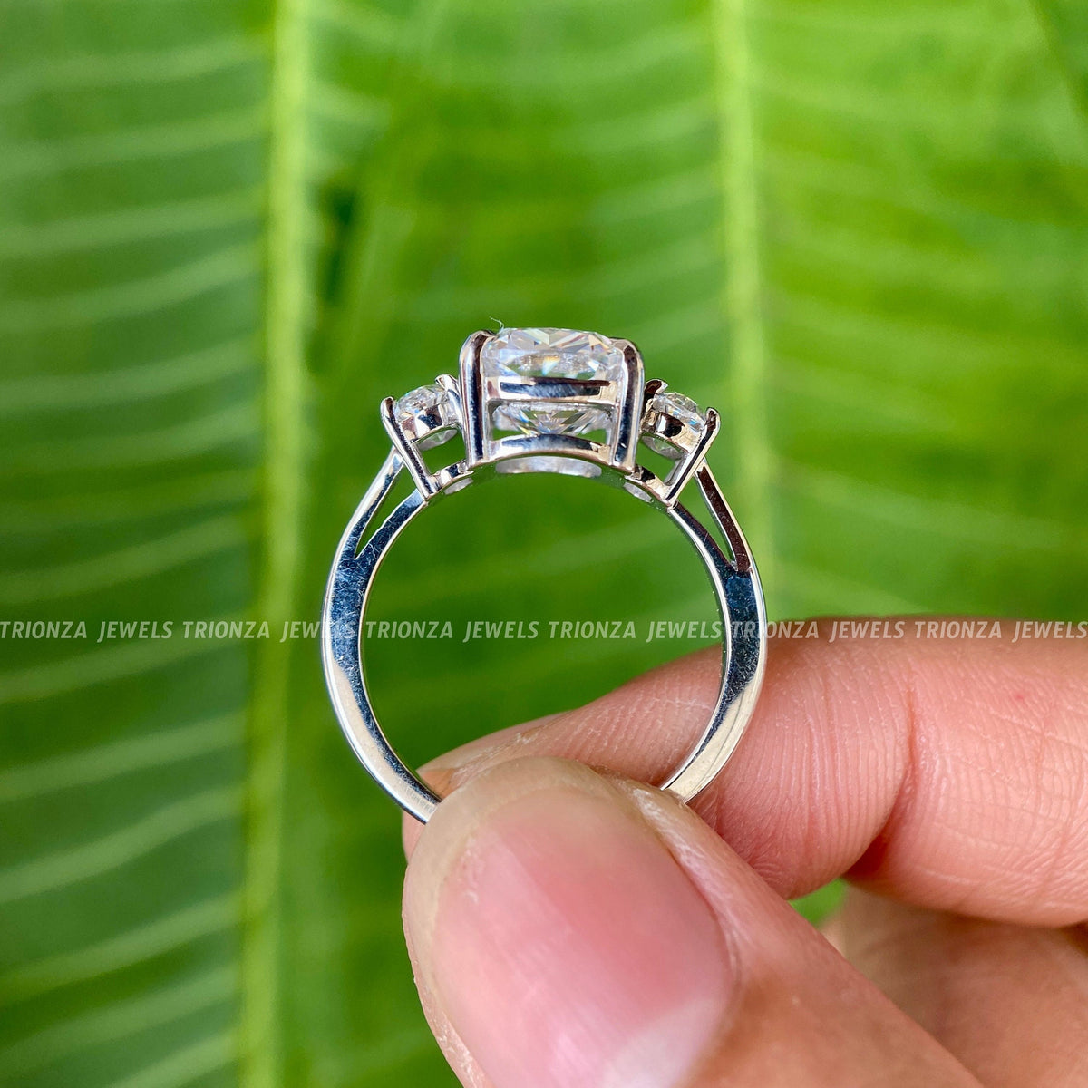 Woman wearing the cushion cut moissanite engagement ring for an elegant everyday look