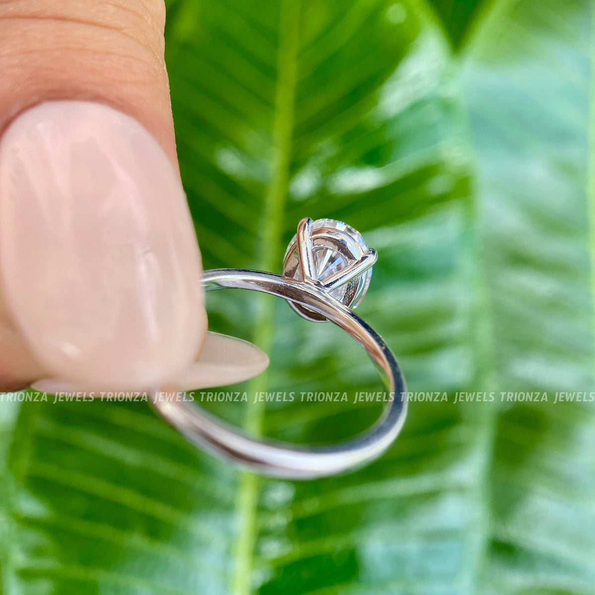 TrionzaDiamond solitaire ring displayed in a jewelry box with smooth fabric