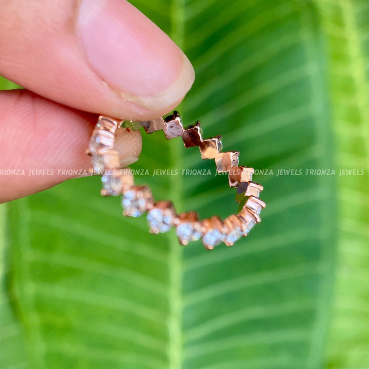 Handcrafted moissanite eternity ring presented in its jewelry box with smooth fabric