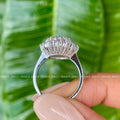 Close-up of the starburst halo setting surrounding the 10x8mm oval moissanite center stone