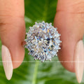 Round moissanite pave set wedding ring band shown alongside the oval halo design