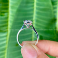 Woman wearing the oval moissanite solitaire ring as an anniversary gift for her