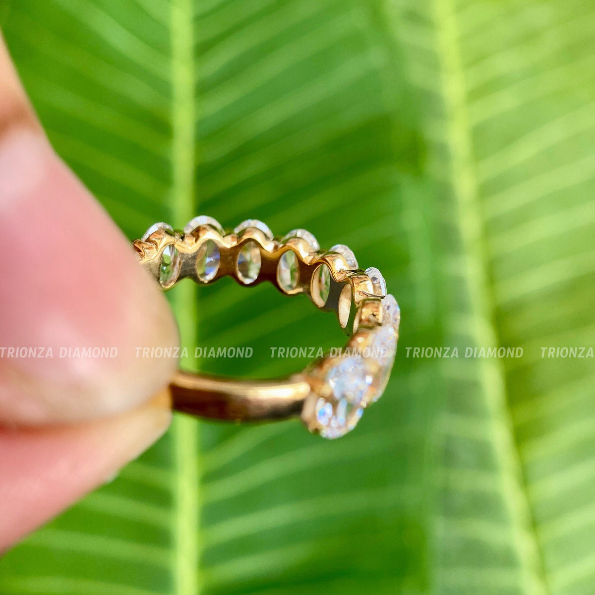 Side view of the half eternity oval band highlighting the 6x4 MM diamond measurements