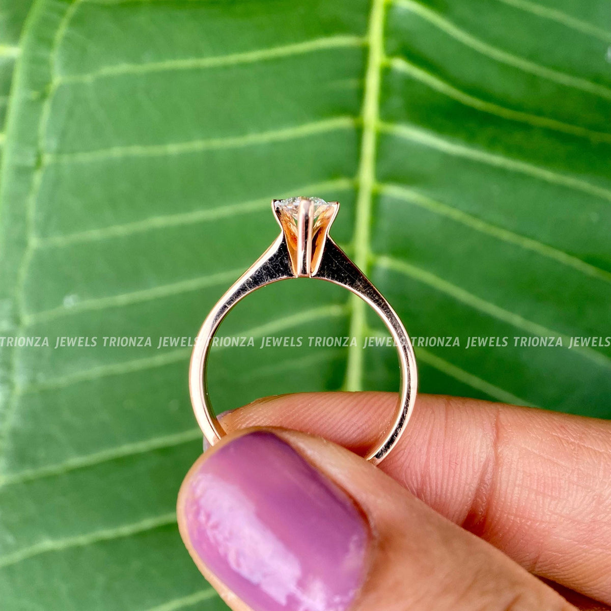 Solitaire moissanite ring displayed in a jewelry box with smooth fabric included