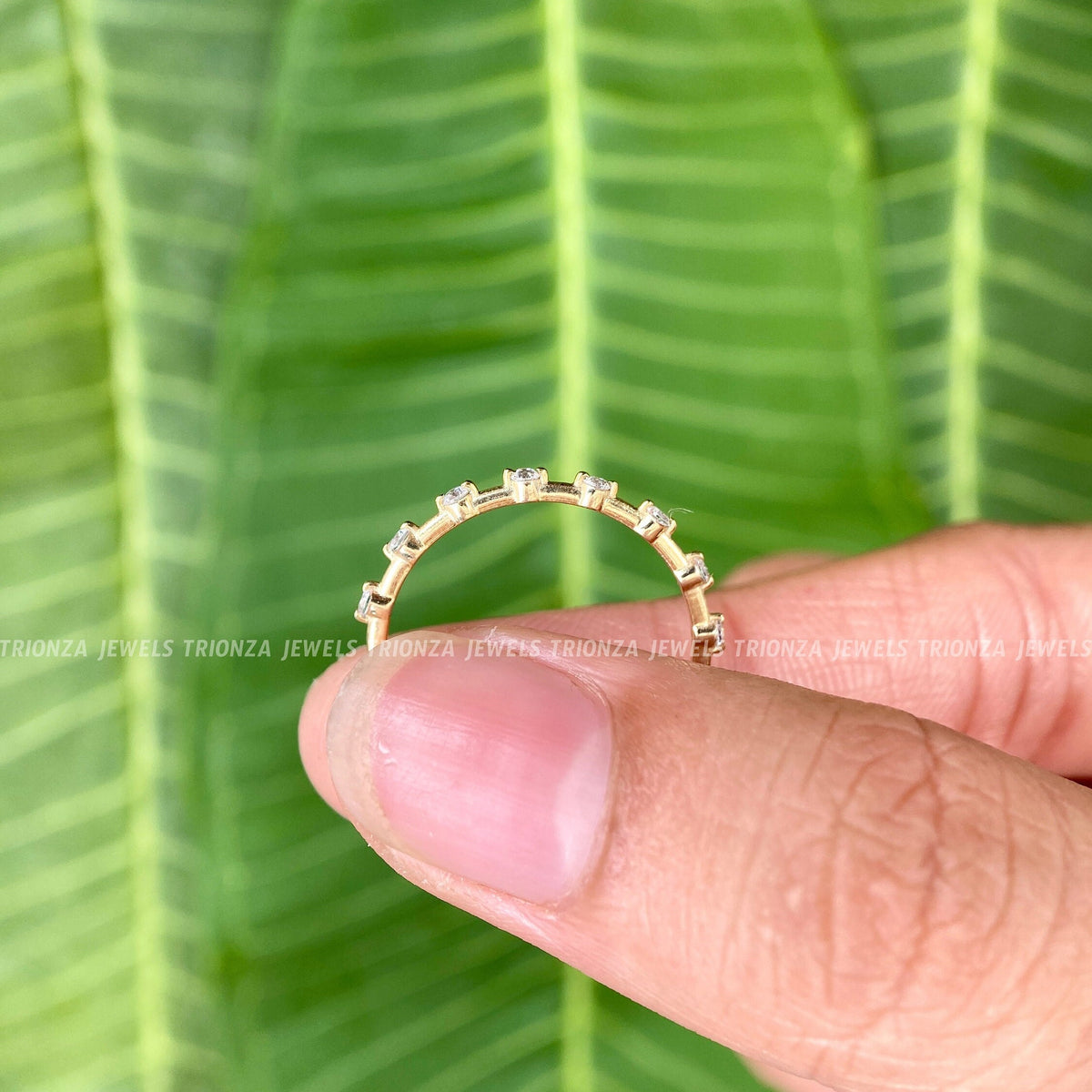 Rose gold half eternity band shown as part of a matching bridal ring set