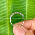 Leaf engraved eternity band displayed to highlight its organic straight band style