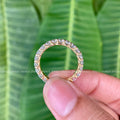 Close-up of the 2.80mm round moissanite stones showing colorless VVS clarity
