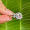 Three stone moissanite ring displayed in a jewelry box showing its handmade craftsmanship
