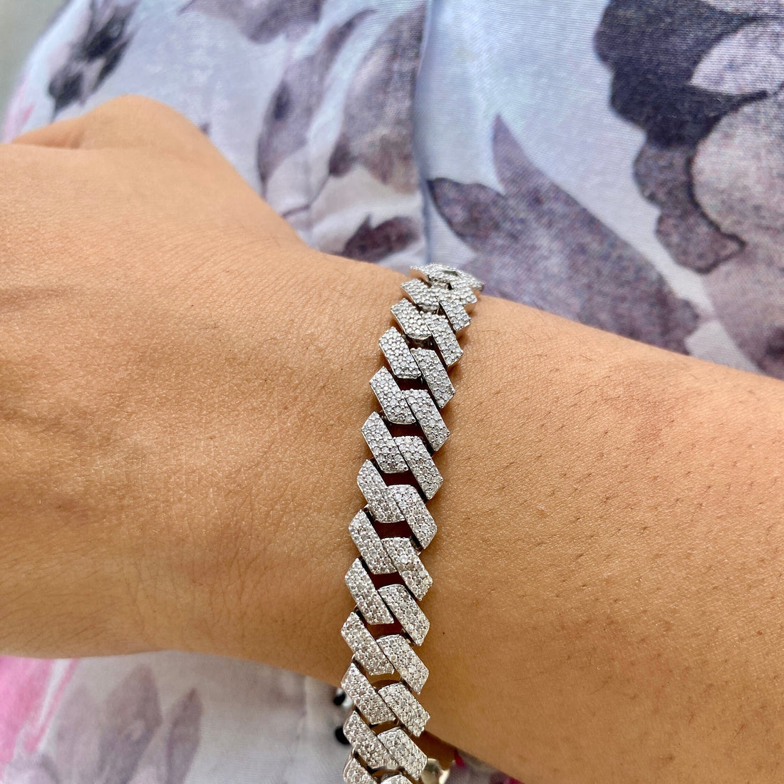 Gold Miami Cuban link chain featuring iced out natural round cut diamonds in 925 sterling silver