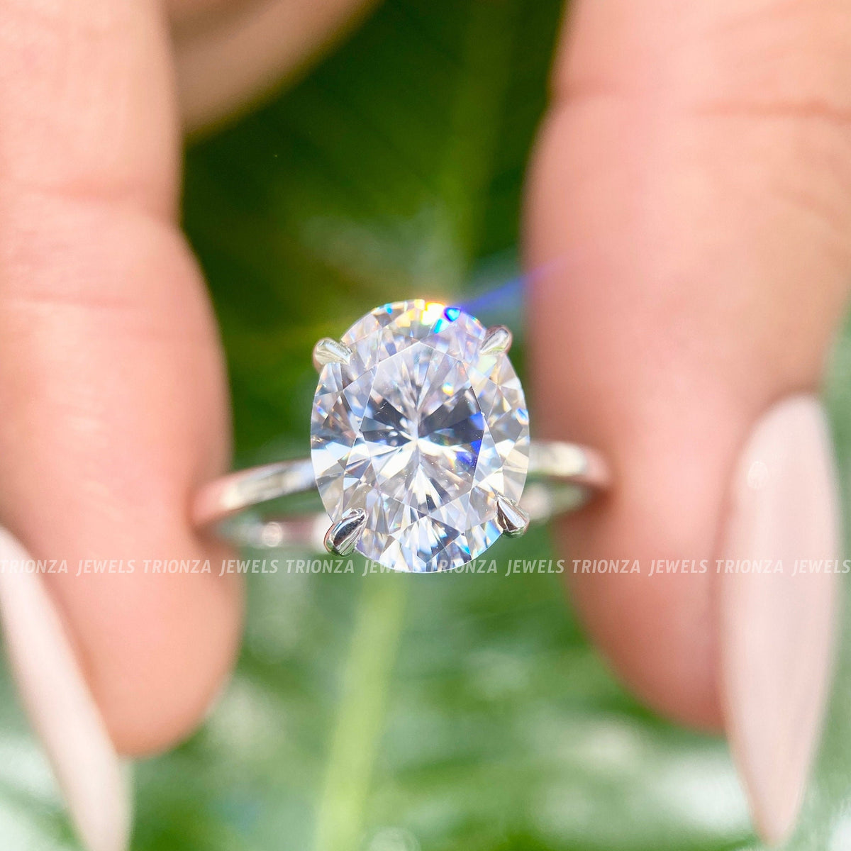 Oval cut moissanite engagement ring featuring a brilliant 3 CT colorless center stone