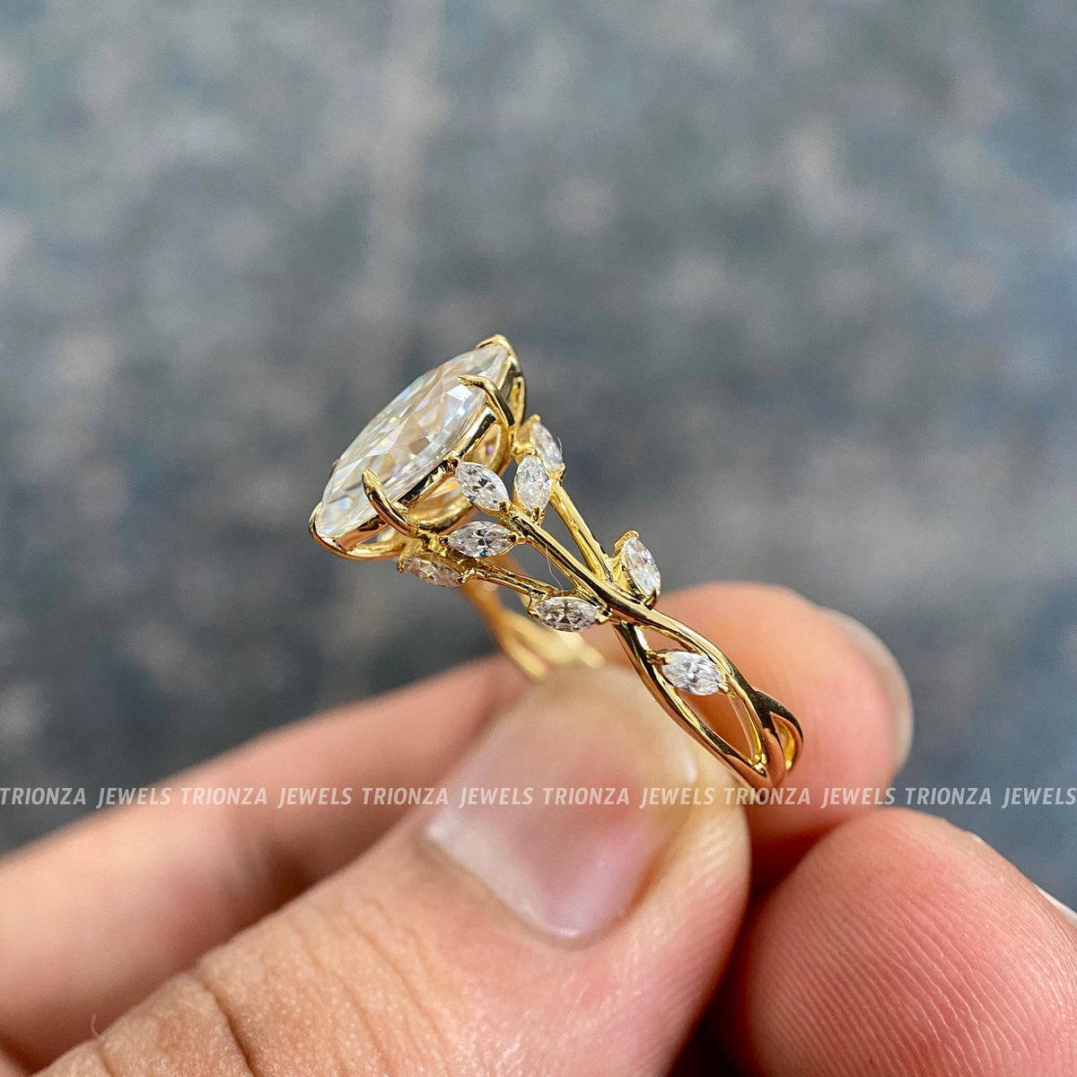 cluster marquise proposal ring showcasing handmade prong and halo setting details for her