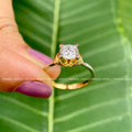 Side view of the moissanite ring showcasing its hallmark stamp and metal finish