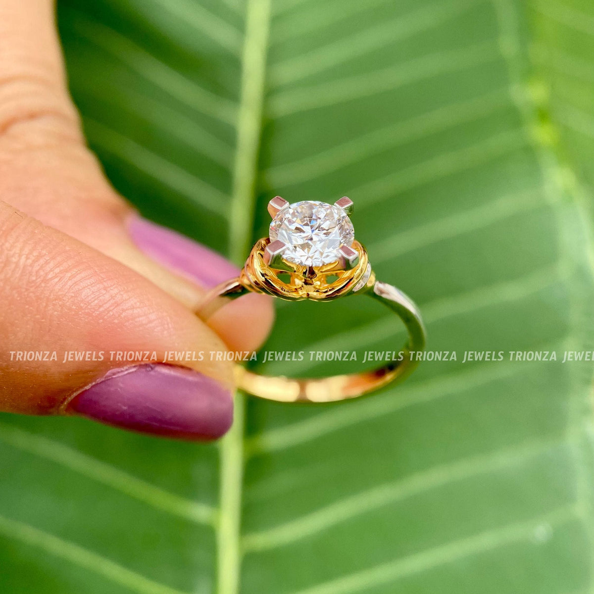 Side view of the moissanite ring showcasing its hallmark stamp and metal finish