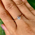 4-prong setting securely holding the 5 MM round moissanite stone