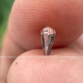 Shield cut diamond shown from an angle emphasizing its 0.68 carat size and shape