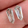 Shield cut lab grown diamond pair displayed to show the E color and VS1 clarity