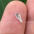 Loose shield shape diamond positioned to show brilliance ideal for an engagement ring