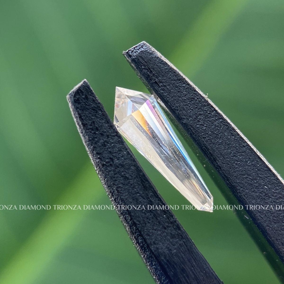 Close-up of the 1 CT shield diamond highlighting its VVS/VS clarity and brilliant facets
