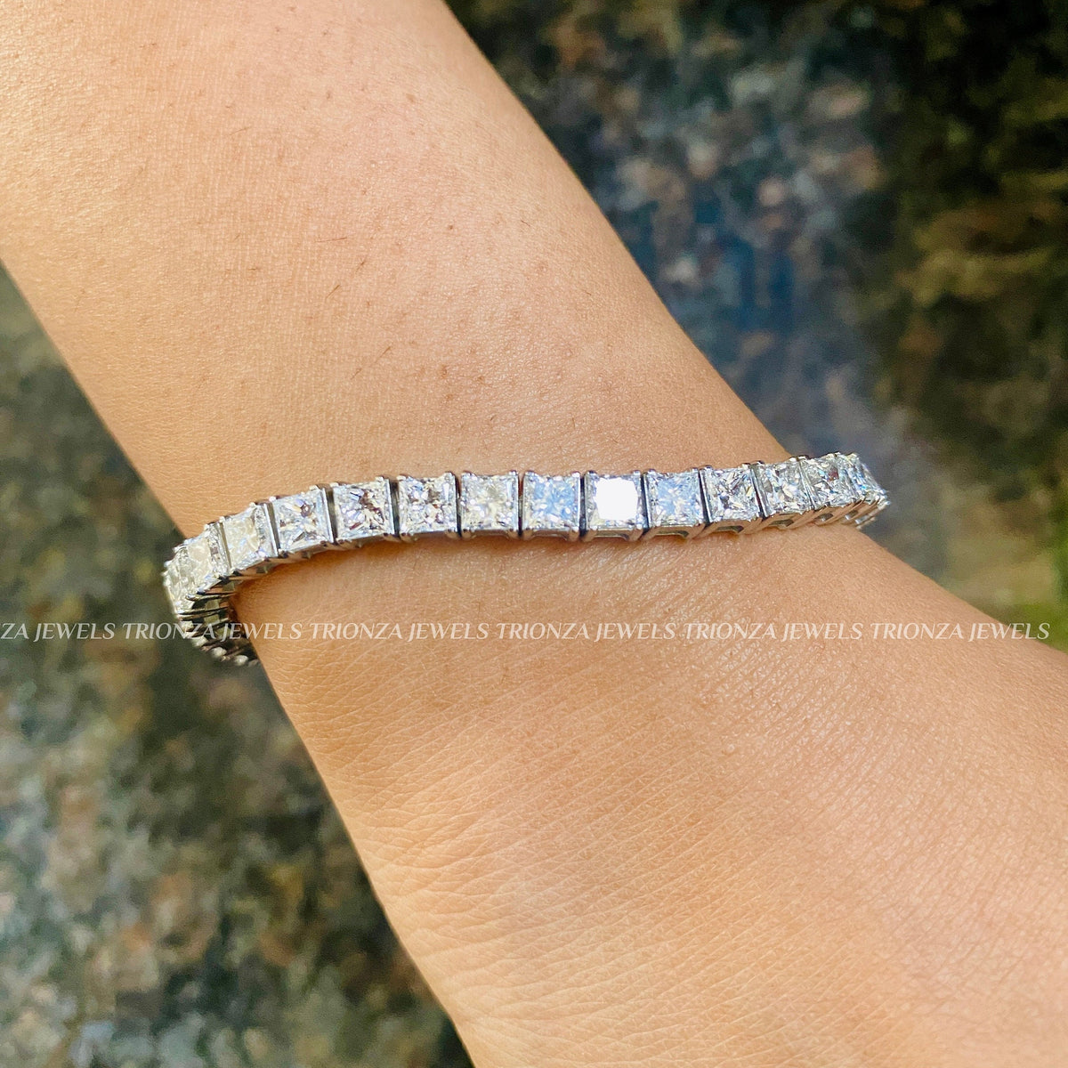 Close-up of the princess cut diamonds showing their F+ color and VS1+ clarity