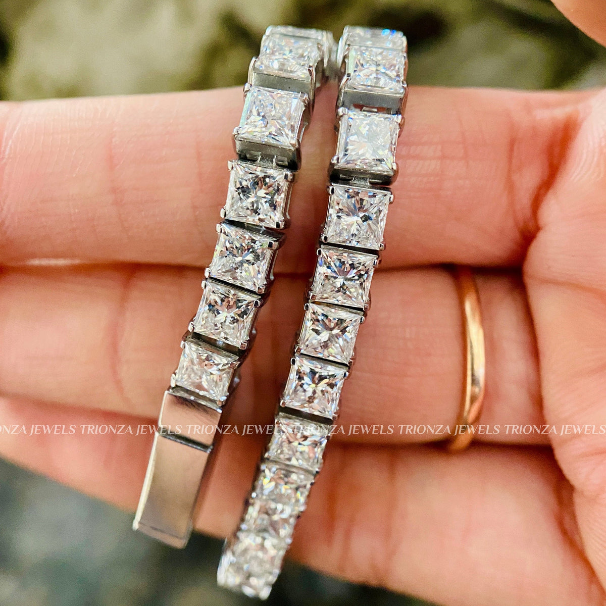 TrionzaDiamond tennis bracelet designed with handcrafted princess cut diamond details