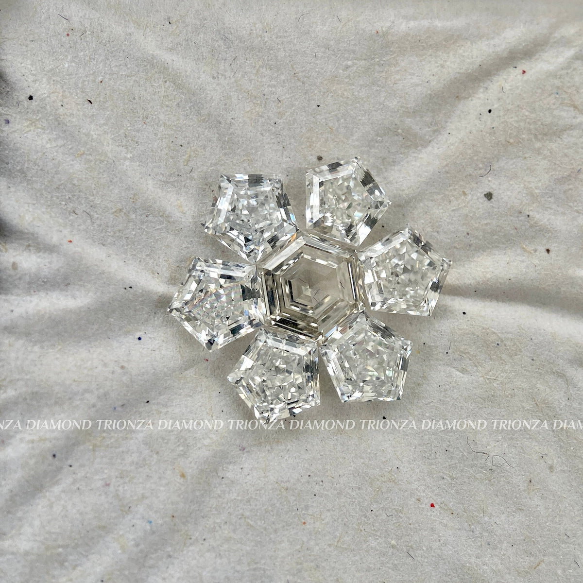 Unique star pendant featuring a lab grown diamond pentagon center with hexagon cut accents