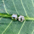 Hexagon cut loose diamonds displayed together highlighting their 1 CT each size and VS1 clarity
