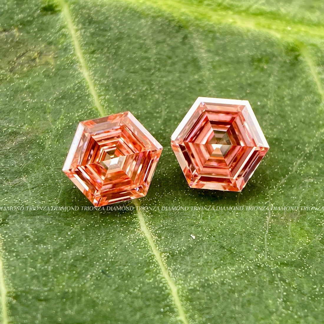 Hexagon cut intense orange lab grown diamond displayed as a loose stone for ring making