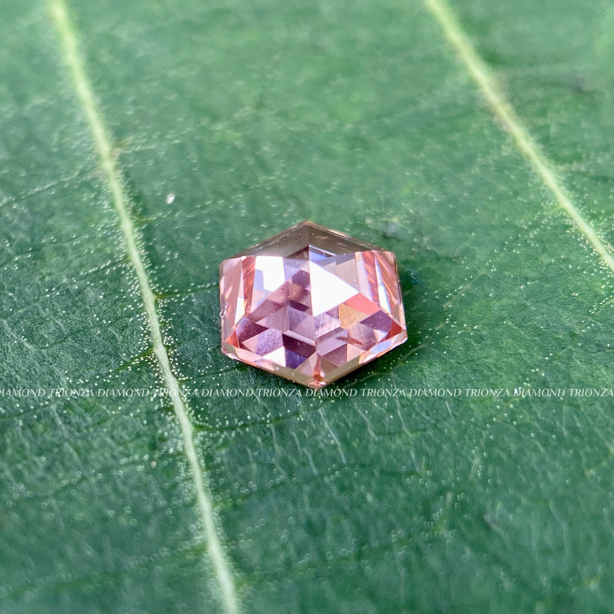 Hexagon step cut lab created diamond suited for side stone engagement ring settings