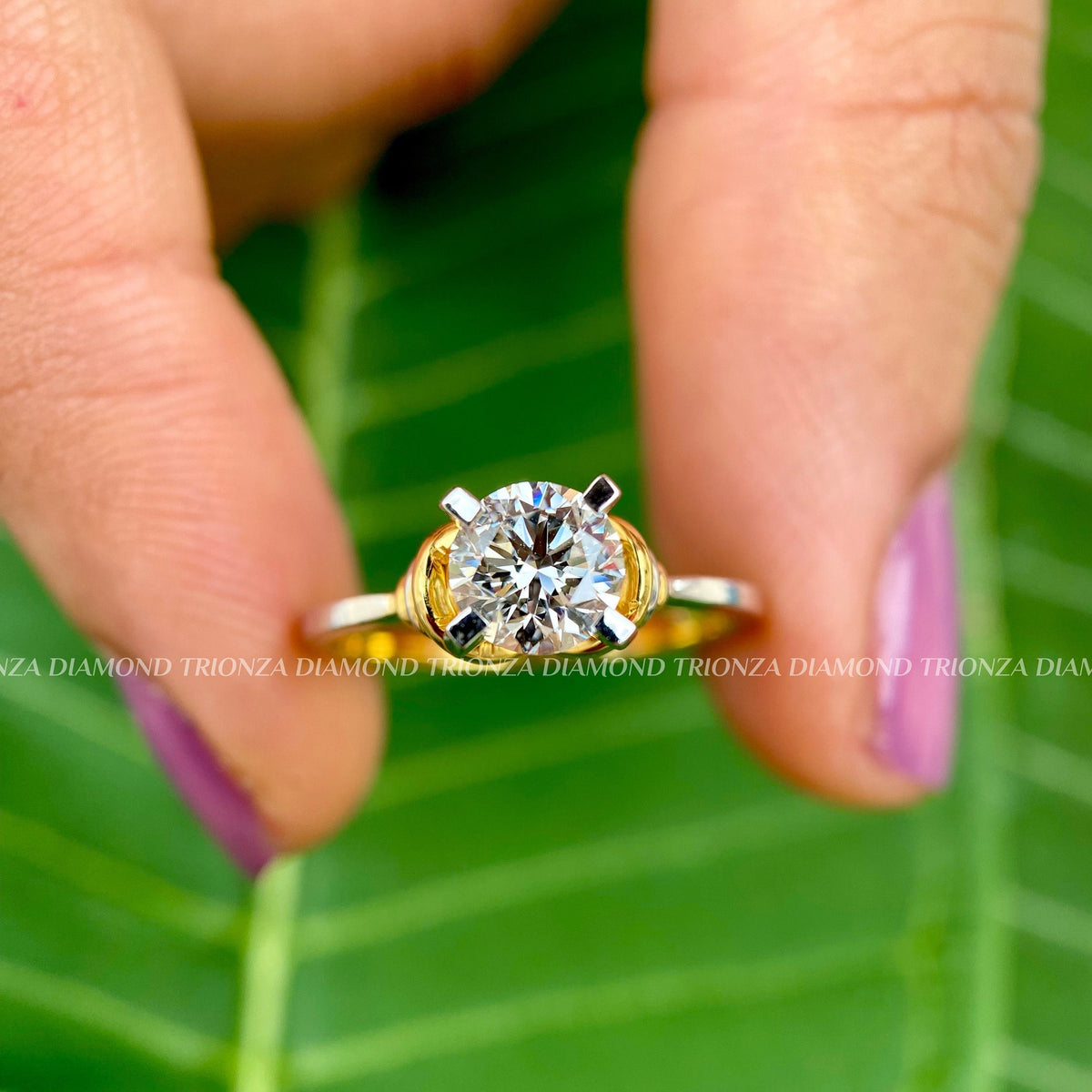 Two tone gold band paired with a round brilliant cut lab grown diamond center stone