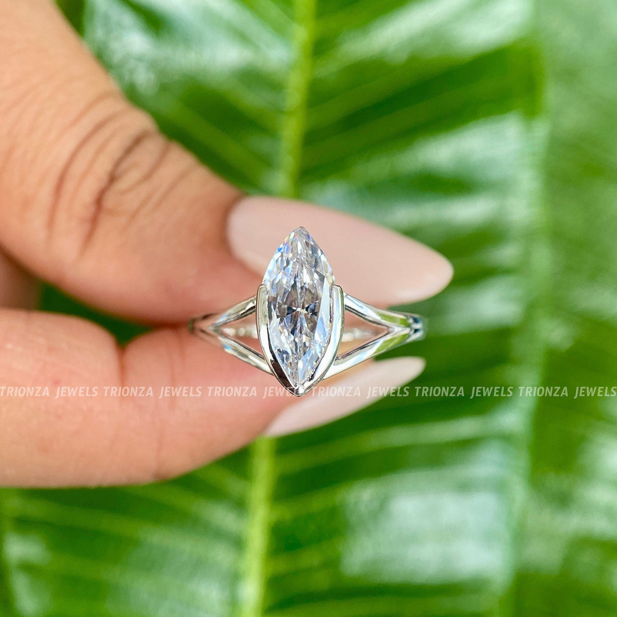 Marquise cut moissanite engagement ring displayed to showcase its knife edge solitaire design