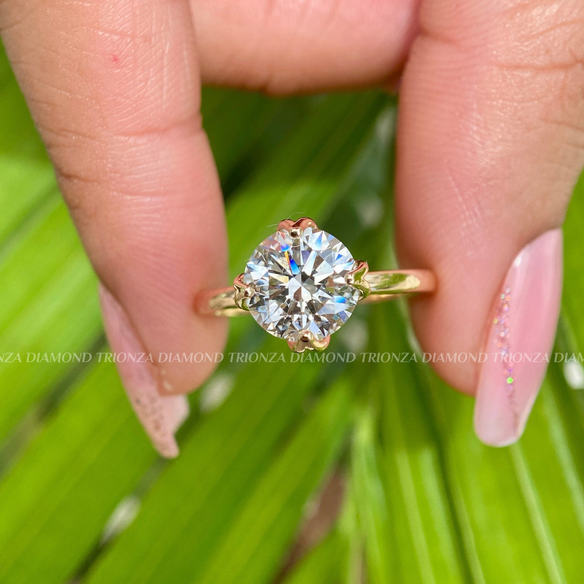 Woman wearing the round diamond solitaire ring, close-up on her hand