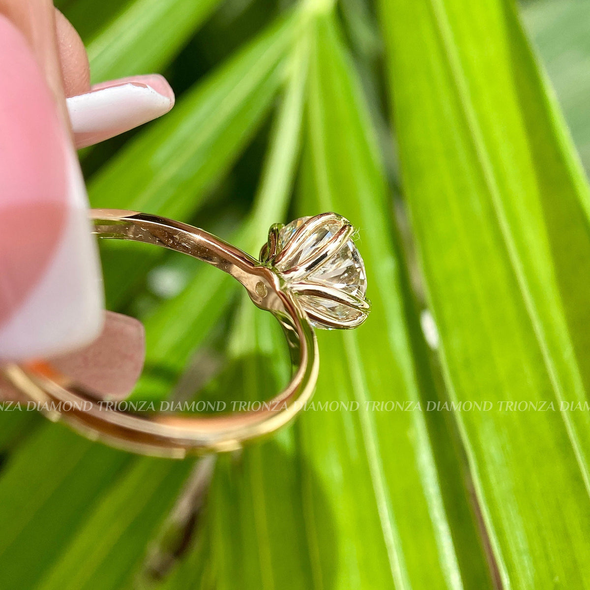 Round diamond ring displayed in a box highlighting its 14K gold band