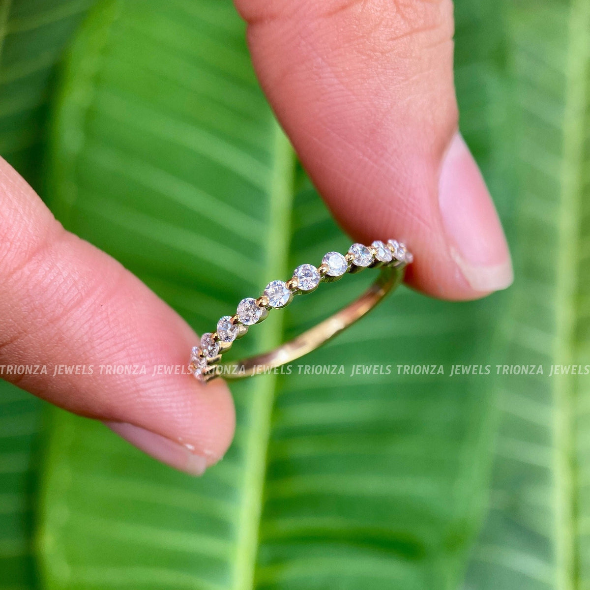 Half floating bubble wedding band in 14K solid gold with round cut moissanite diamonds