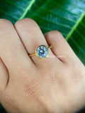 Round cut moissanite bezel set ring crafted in 14k solid yellow gold for a minimalist look