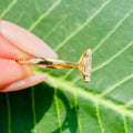 Close-up of the 1.50 CT marquise moissanite showing near colorless VVS clarity and excellent luster