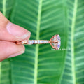 Close-up of the 6 claw prong setting securing the round moissanite stone