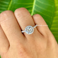 Close-up of the round cut moissanite showing its colorless VVS clarity and brilliant facets