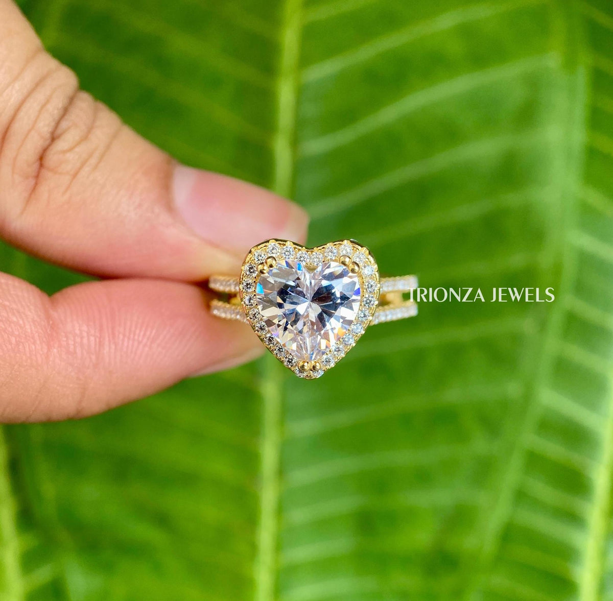 Heart cut moissanite ring displayed in a jewelry box with smooth fabric included