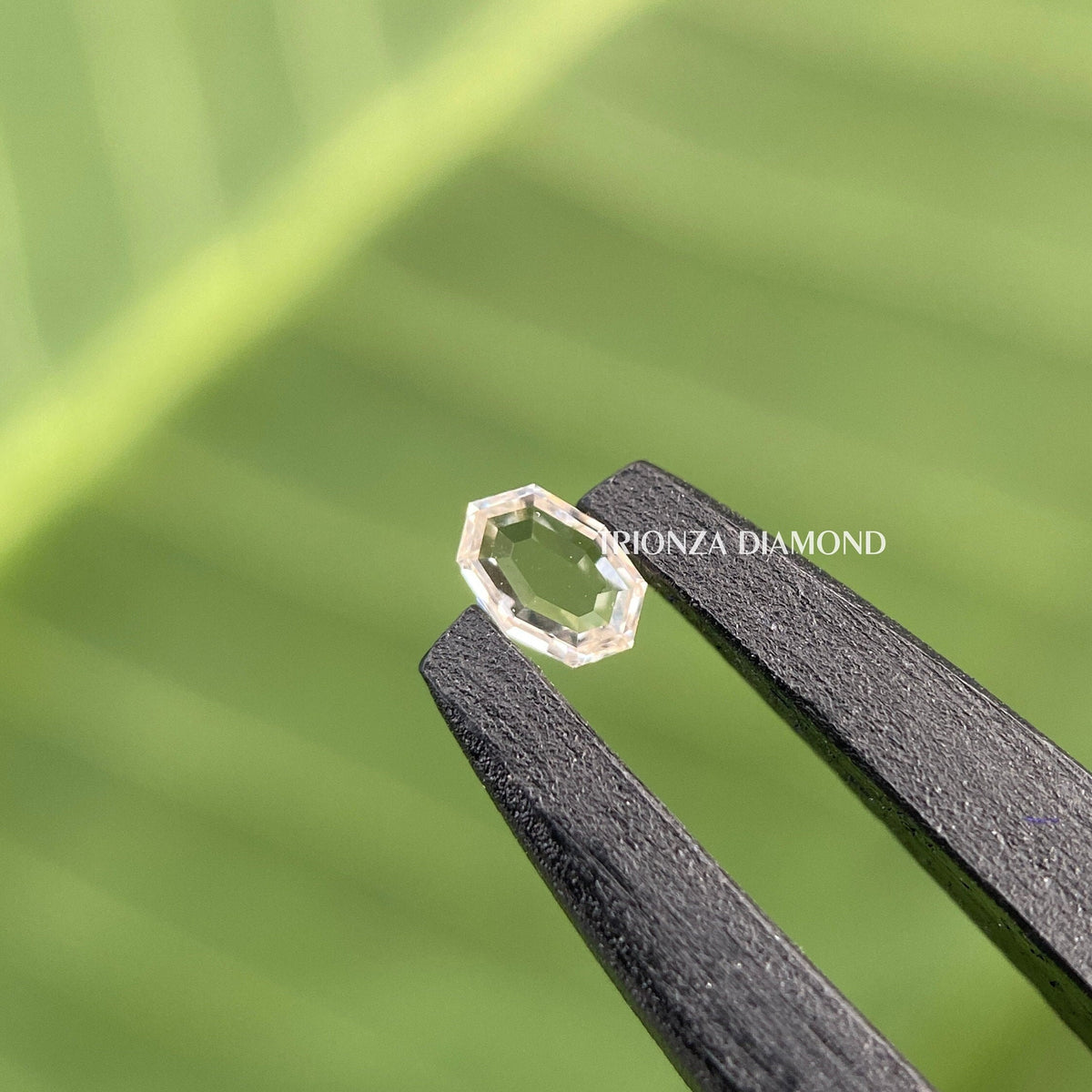 Oval rose step cut lab grown diamond displayed to showcase its fancy cut faceting